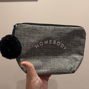 Gray HOME BODY Pouch with Black Pom Pom
